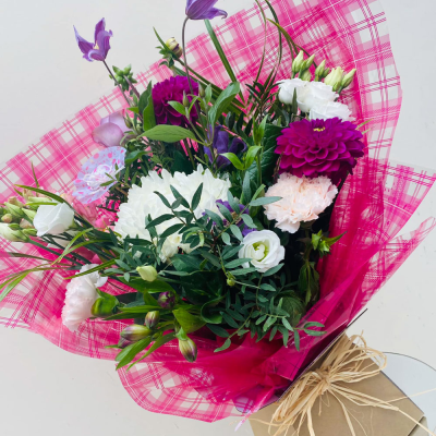 Ashleigh - A budding delight, complimented by greenery and presented in a gift box/bag. Beautiful flower bouquet hand delivered by the local florist.