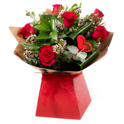 Kissing Booth - 6 standard red roses hand-tied or arranged in Oasis with choice filler and foliage with a novelty item presented in a gift box or bag.