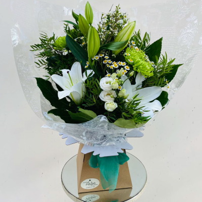 Evelyn - A fabulous collection of white and cream flowers make this the perfect gift. This bouquet will be hand delivered by the local florist.