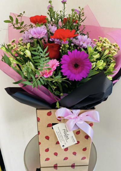 Mixed Blossom Delight - A delightful bouquet bursting with a variety of colourful blooms, This arrangement is ideal for celebrating any occasion, bringing a touch of joy and beauty to any setting.