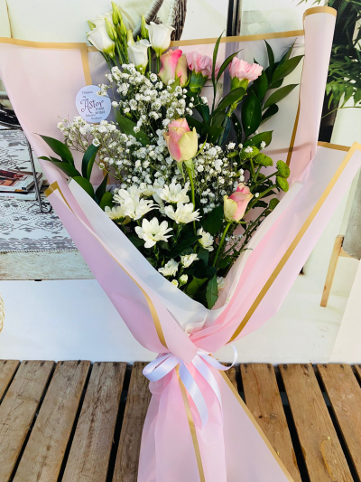 Pretty in Pink - Beautiful bouquet of pink and white flowers wrapped in paper with a nice ribbon